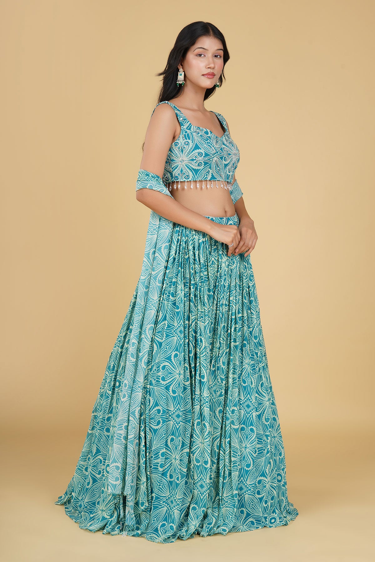 TURQUOISE JAAL HIGHLIGHTED AND PRINTED LEHENGA SET