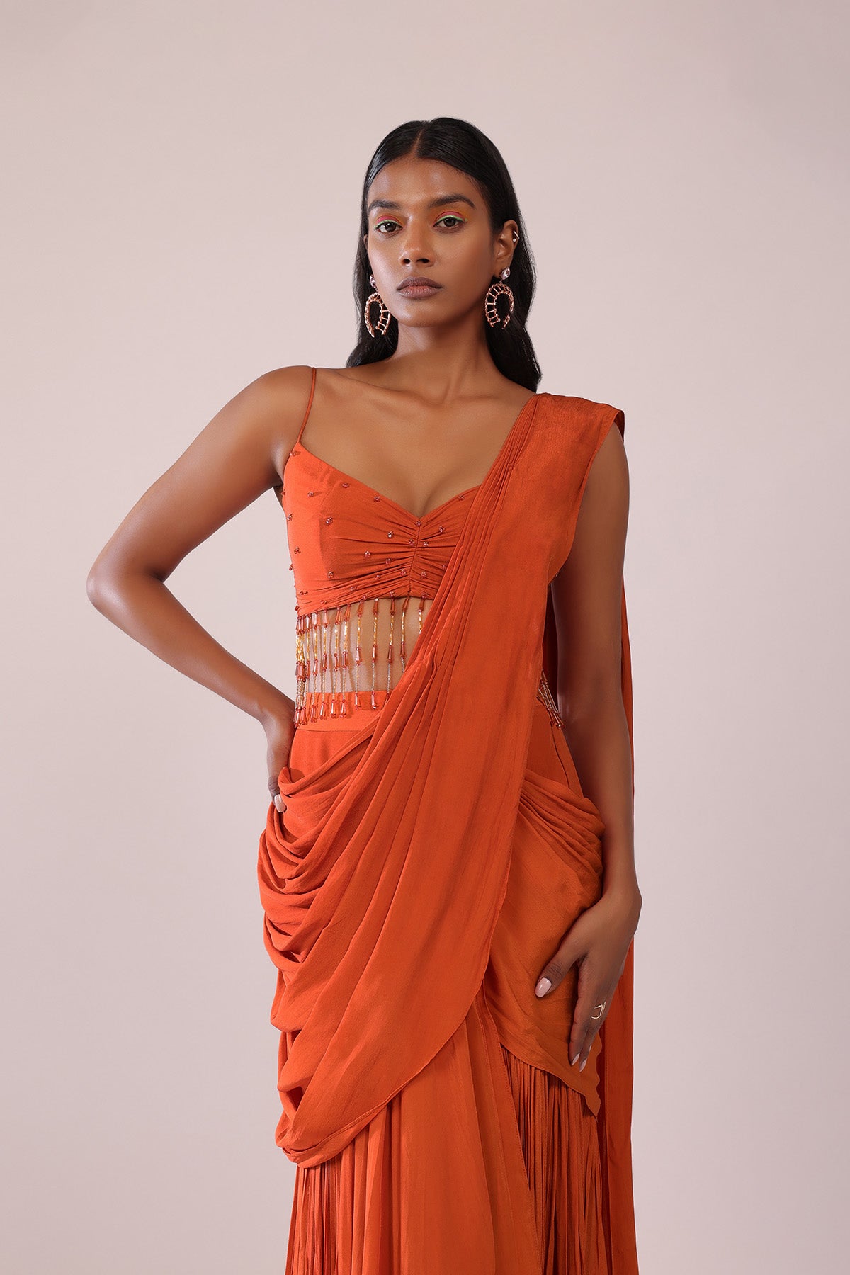 Orange Crepe Drape Saree And Blouse With Crystal Tassels All Over