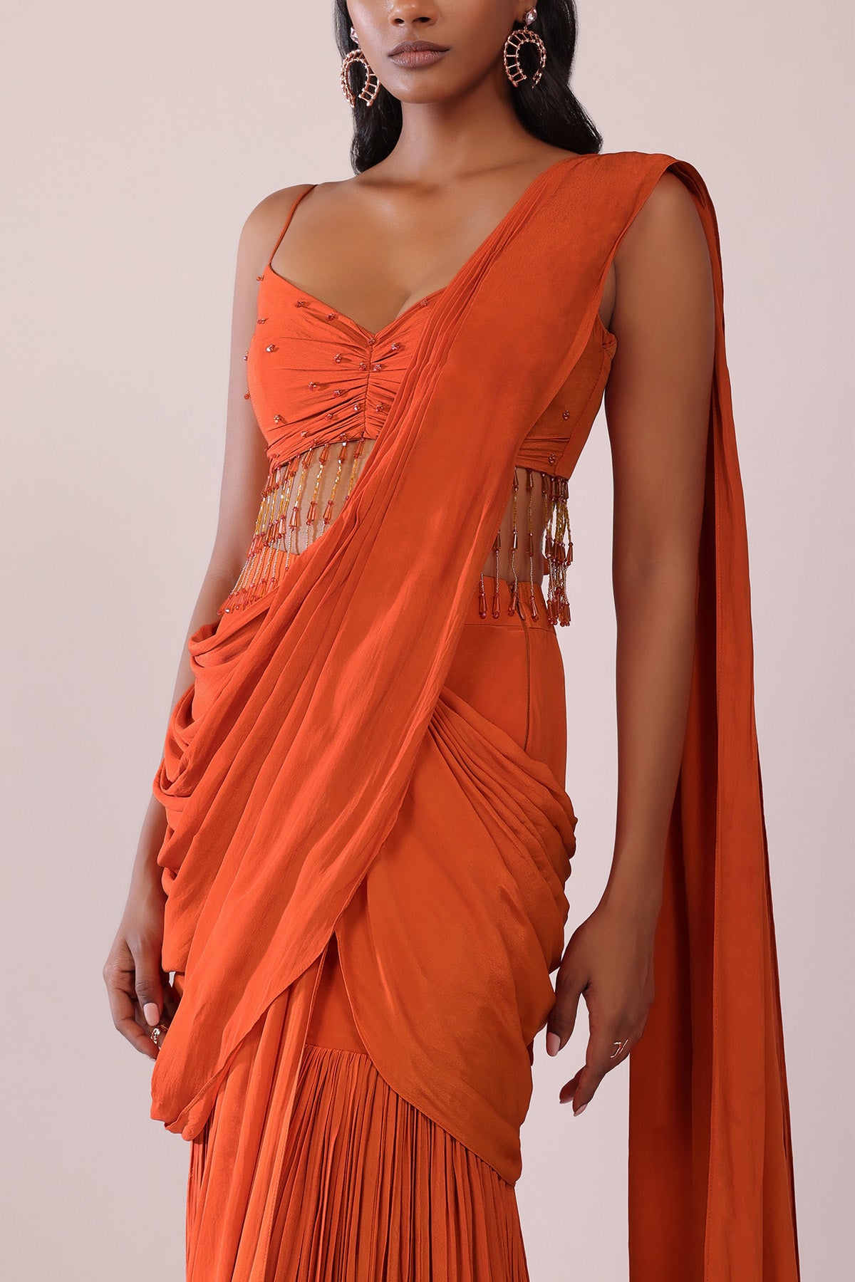 Orange Crepe Drape Saree And Blouse With Crystal Tassels All Over
