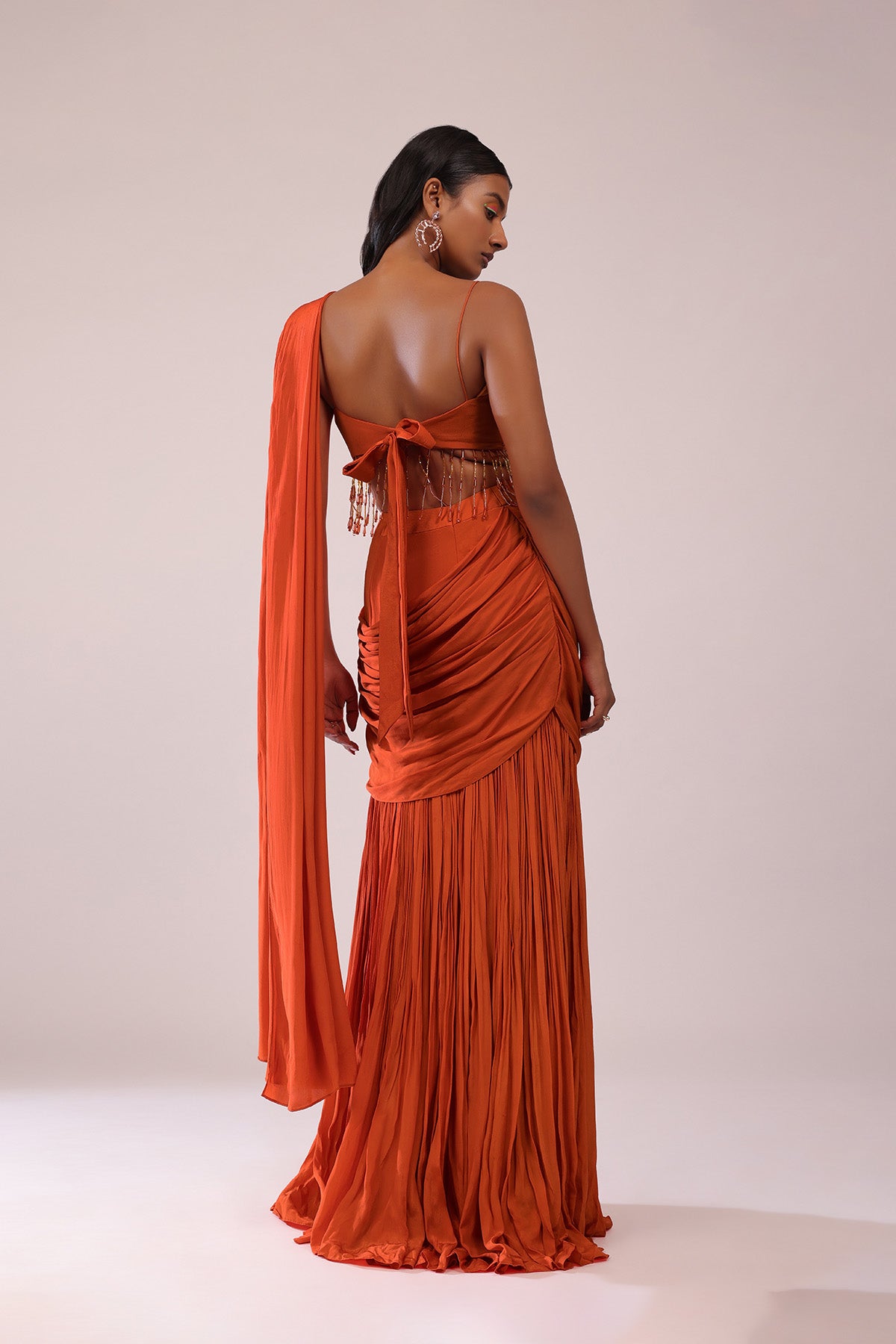 Orange Crepe Drape Saree And Blouse With Crystal Tassels All Over