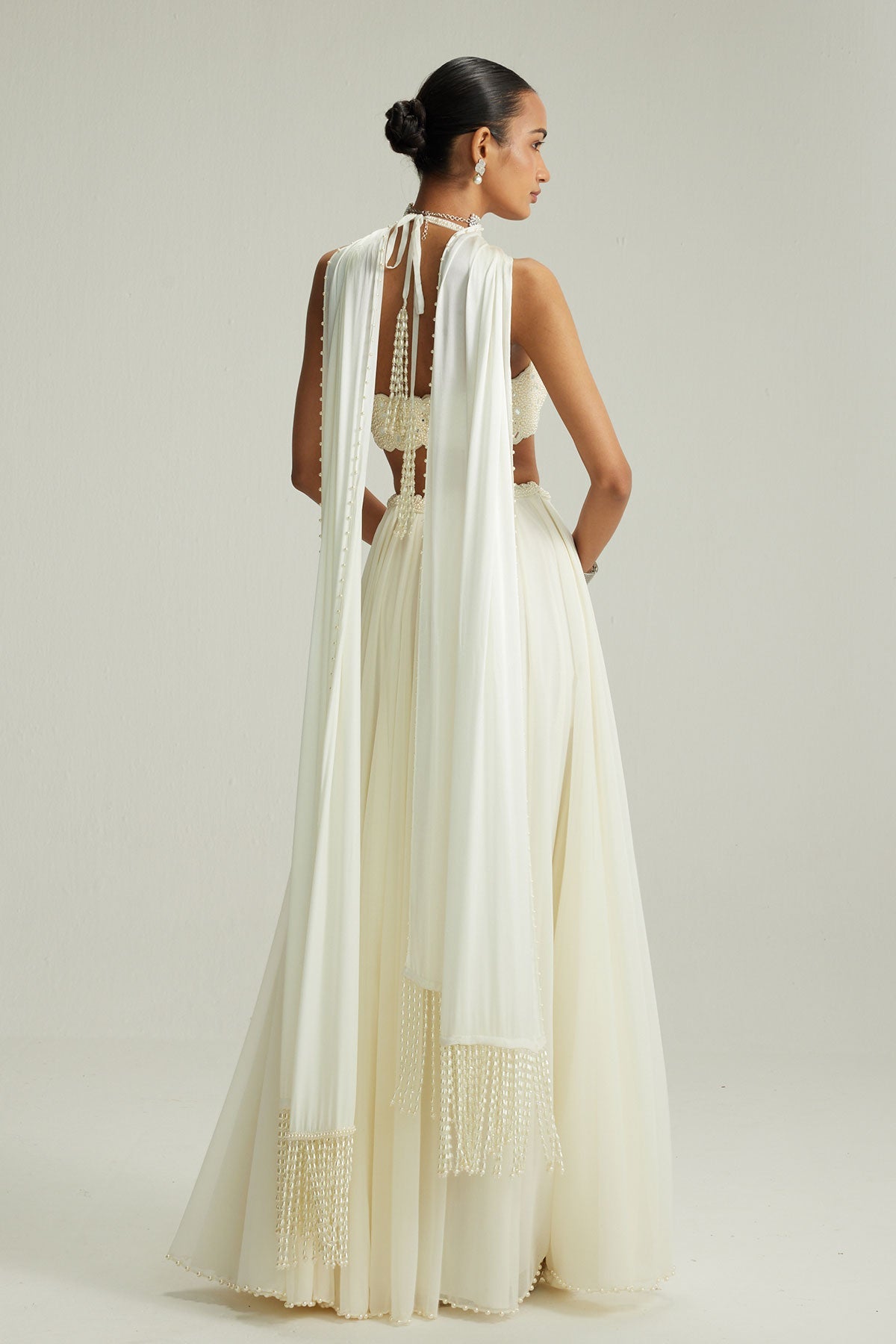 Off White Skirt Set With Halter Neck Blouse