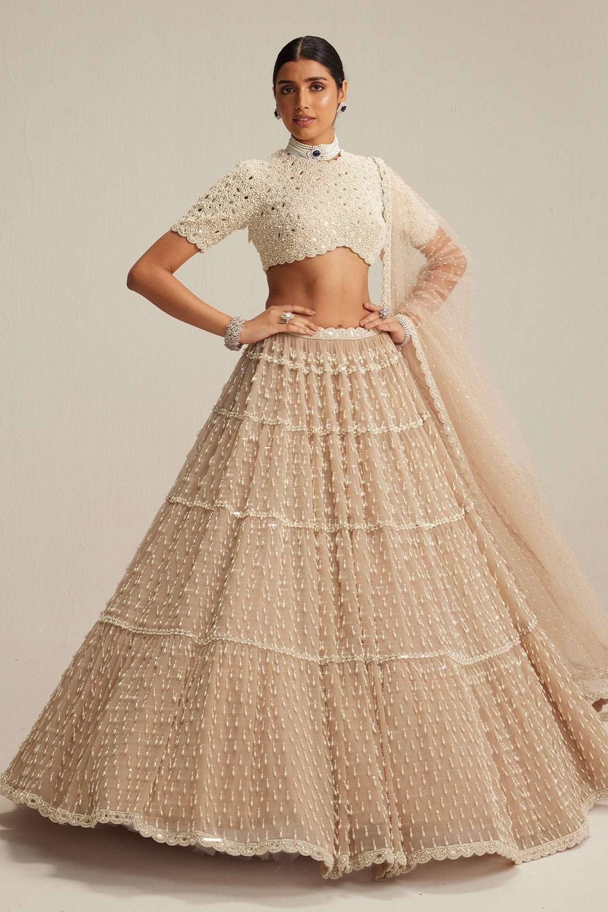 Light Beige Pearl Drop Multi Tier Lehenga With High Neck Blouse Set.