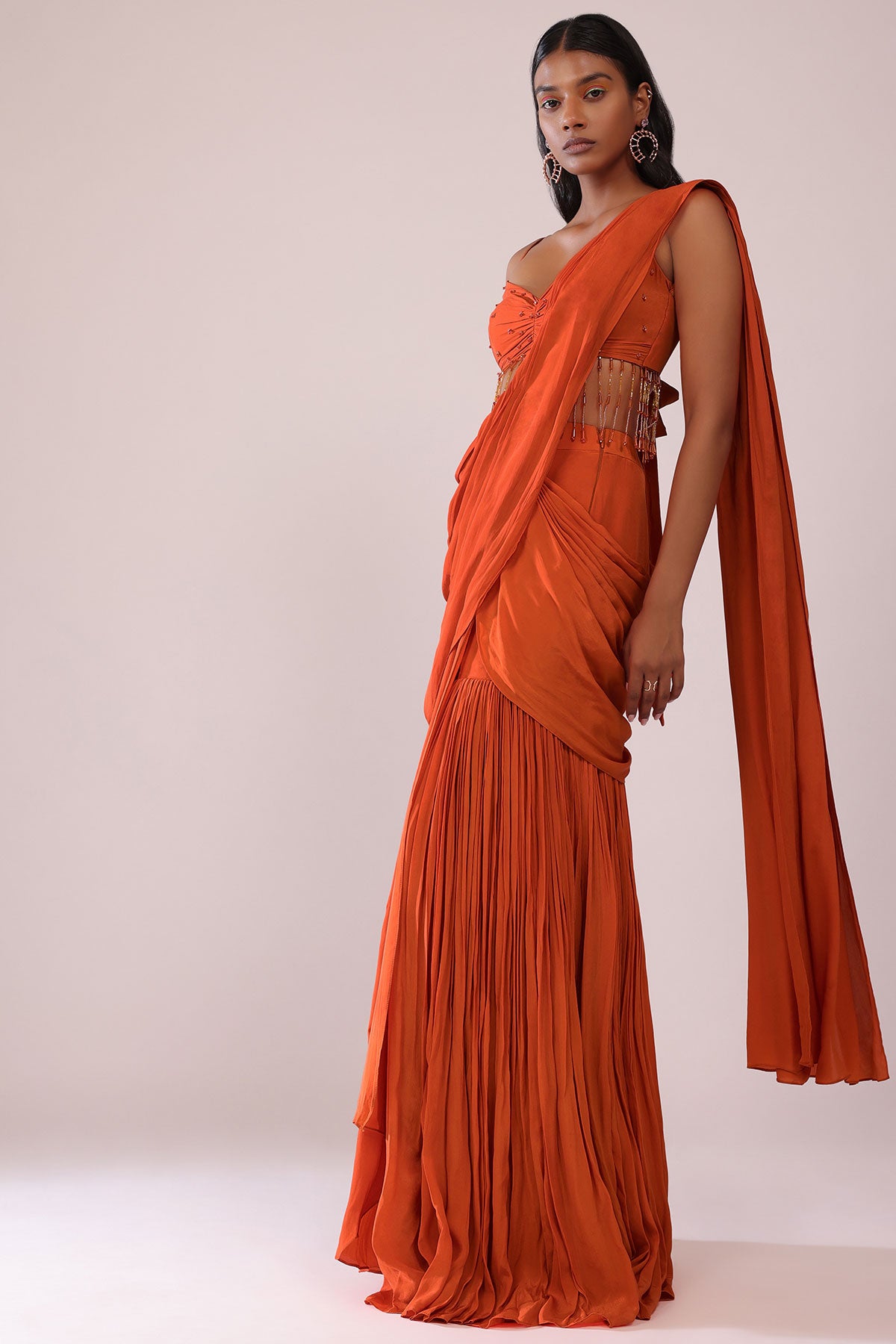 Orange Crepe Drape Saree And Blouse With Crystal Tassels All Over