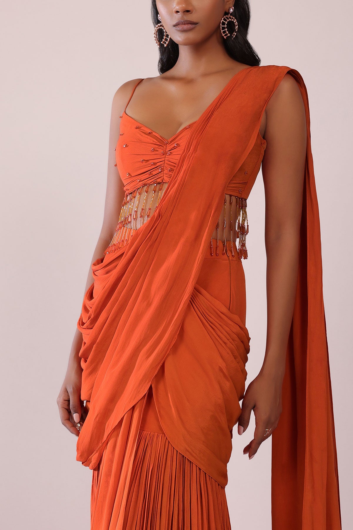 Orange Crepe Drape Saree And Blouse With Crystal Tassels All Over