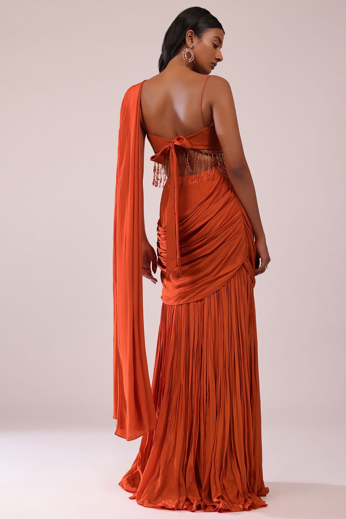 Orange Crepe Drape Saree And Blouse With Crystal Tassels All Over