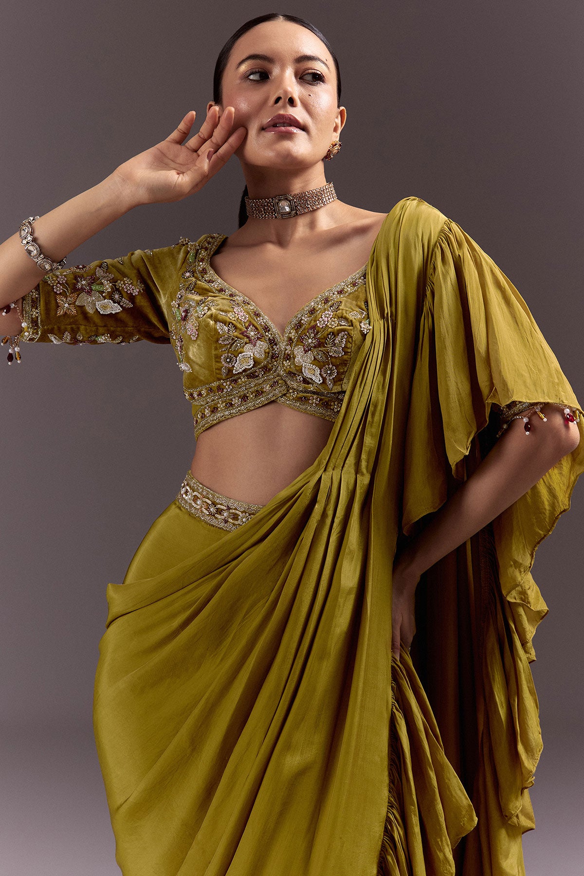 Olive Green Velvet Saree With Frilled Pallu And Heavy Embroidered Blouse