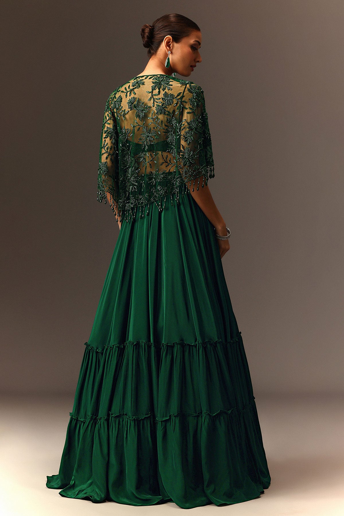 Bottle Green Tiered Lehenga With Net Cape