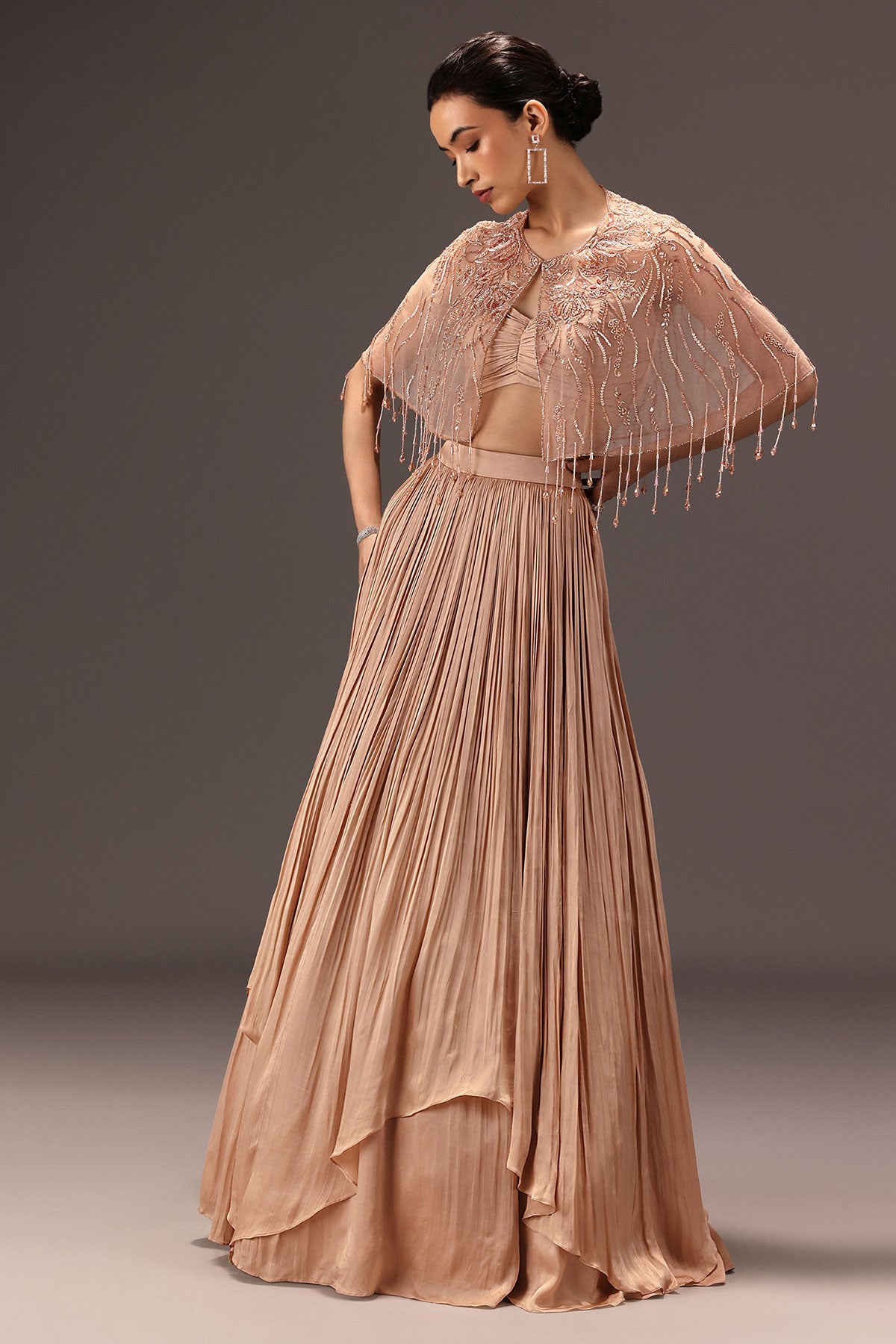 Nude Ruched Blouse With Cape And Layered Skirt