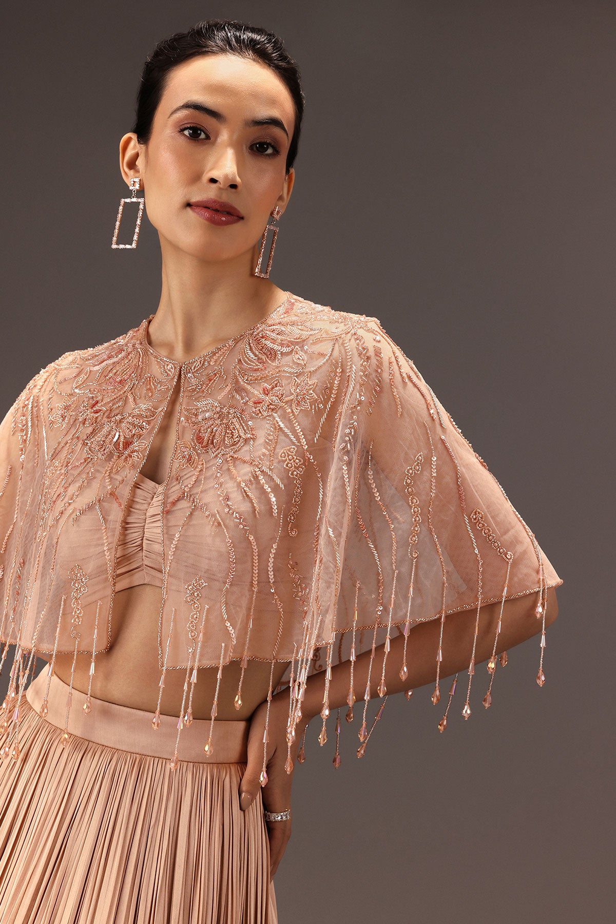 Nude Ruched Blouse With Cape And Layered Skirt