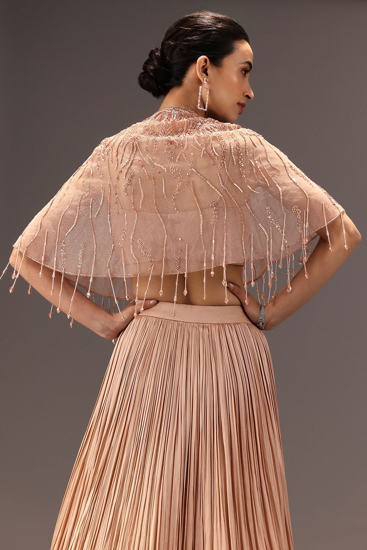 Nude Ruched Blouse With Cape And Layered Skirt