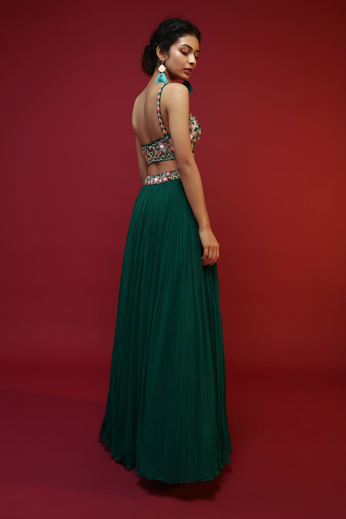 Bottle Green Lehenga Choli And Sleeveless Peplum Jacket Adorned With Colorful Resham And Moti Embroidered Flowers