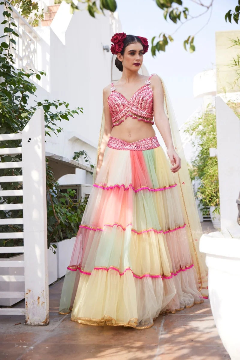 Multi colour frill lehenga , fushia blouse