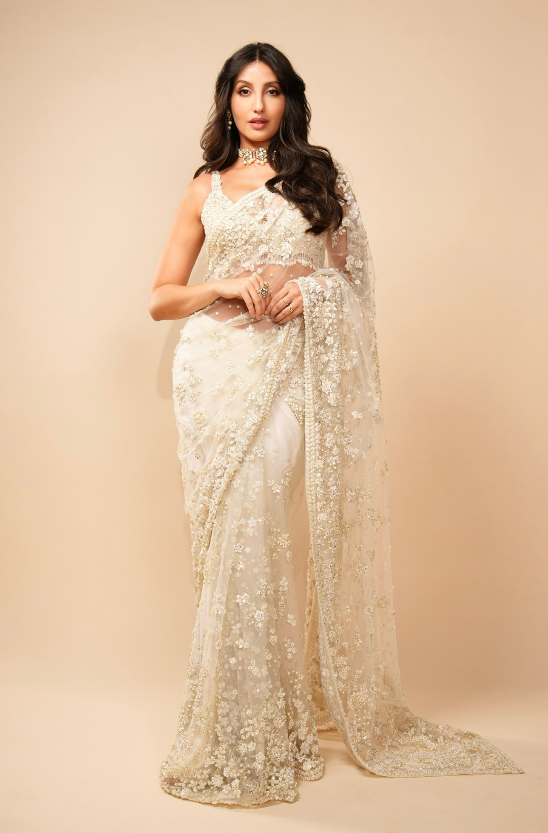 Nora Fatehi in Ivory Three-dimensional Saree