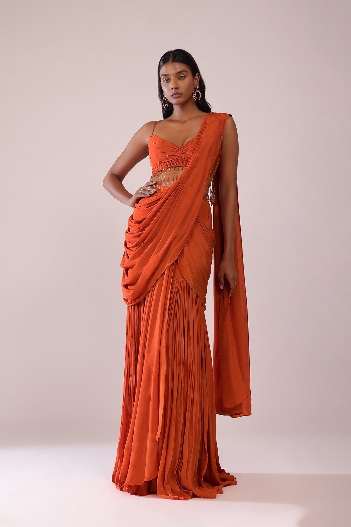 Orange Crepe Drape Saree And Blouse With Crystal Tassels All Over