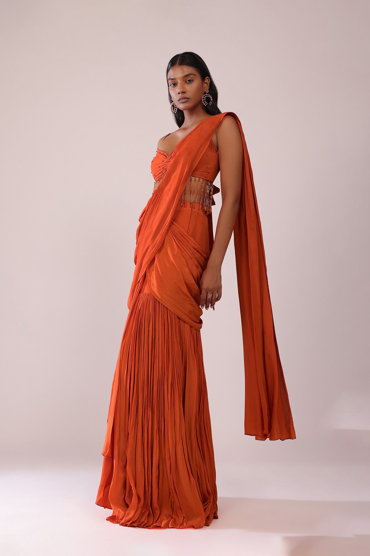 Orange Crepe Drape Saree And Blouse With Crystal Tassels All Over