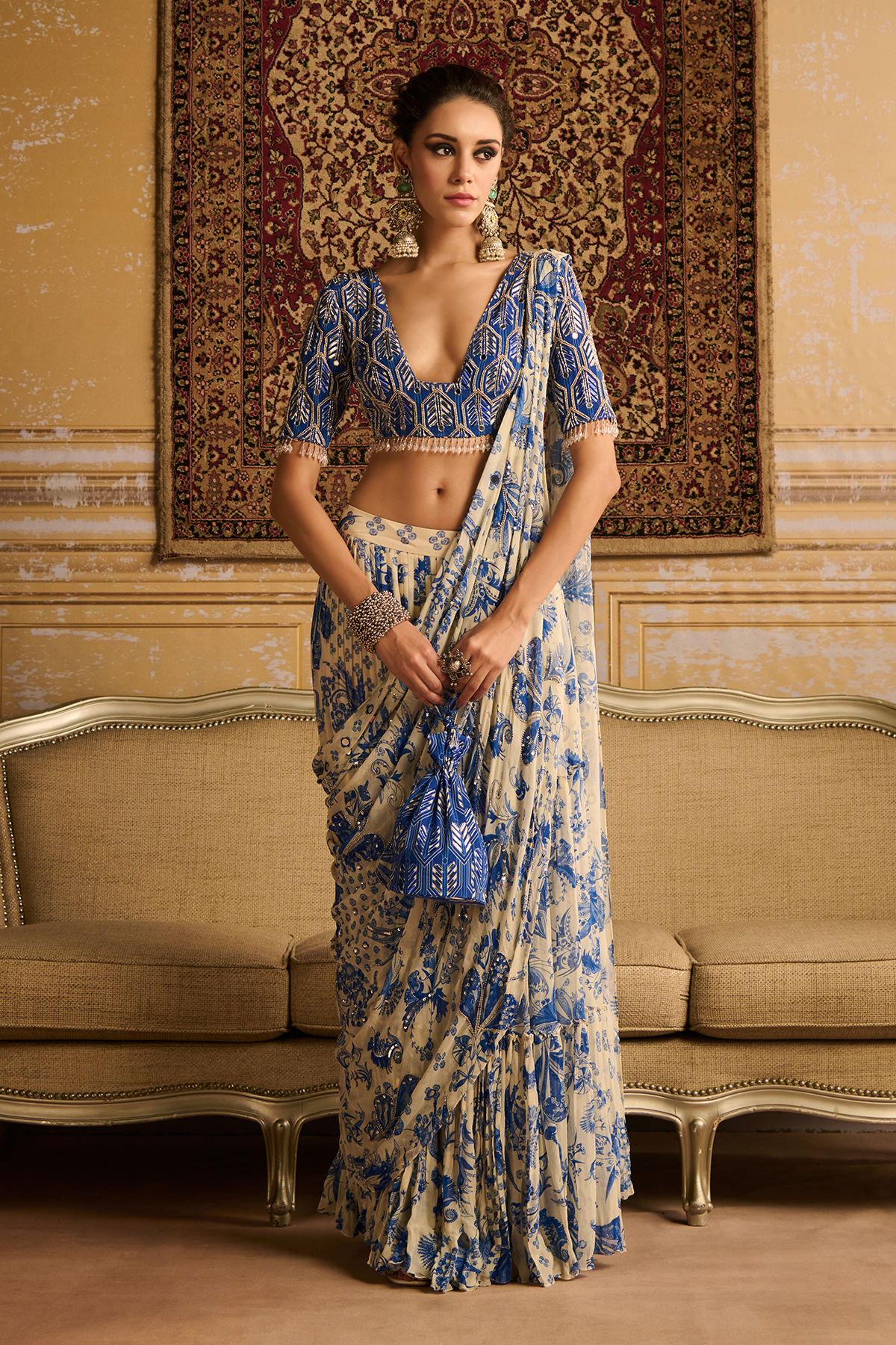 Blue highlighted blouse and  tiered saree set