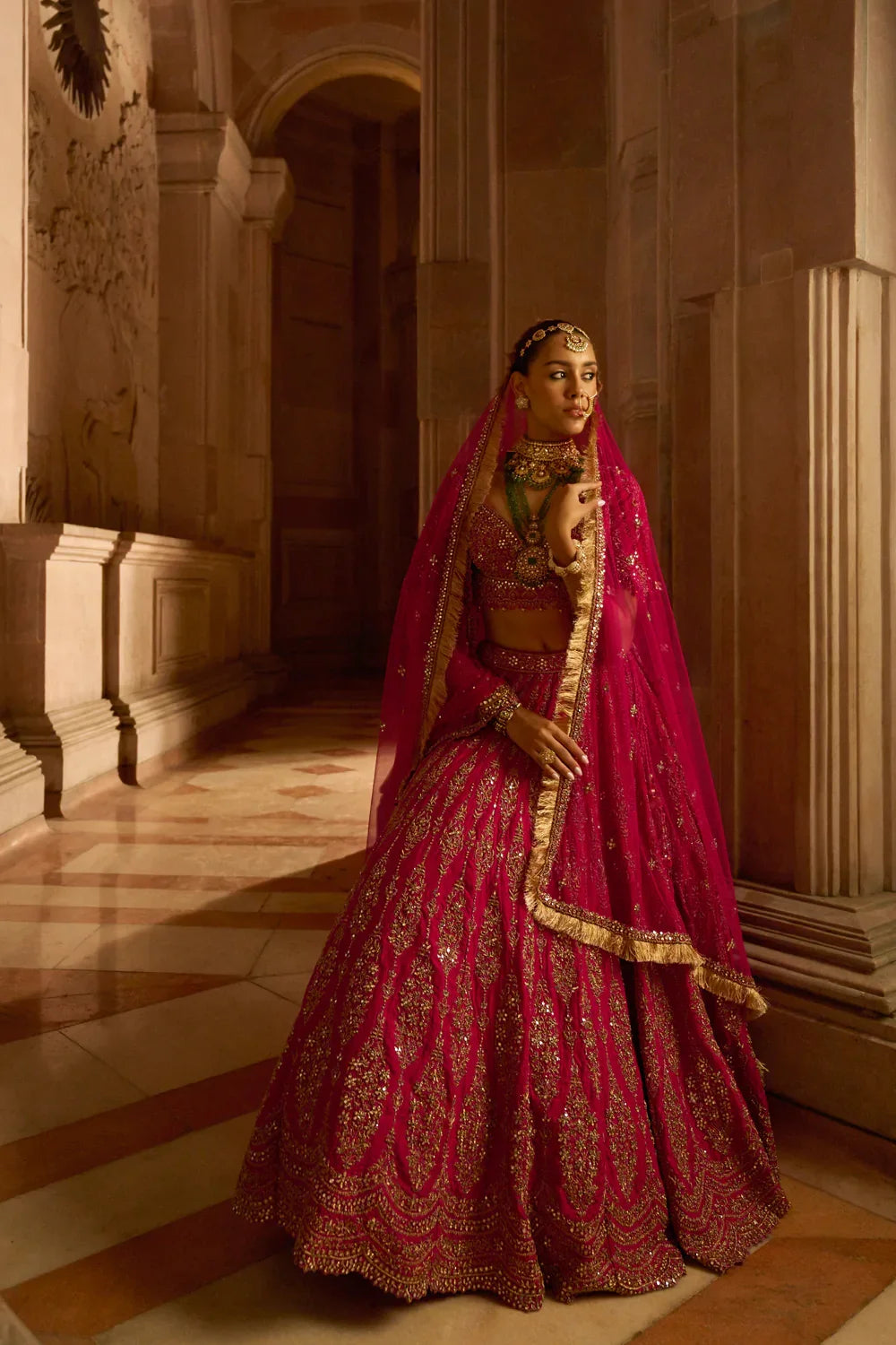 FUCHSIA RED RAW SILK BRIDAL LEHENGA CHOLI WITH A TULLE DUPATTA