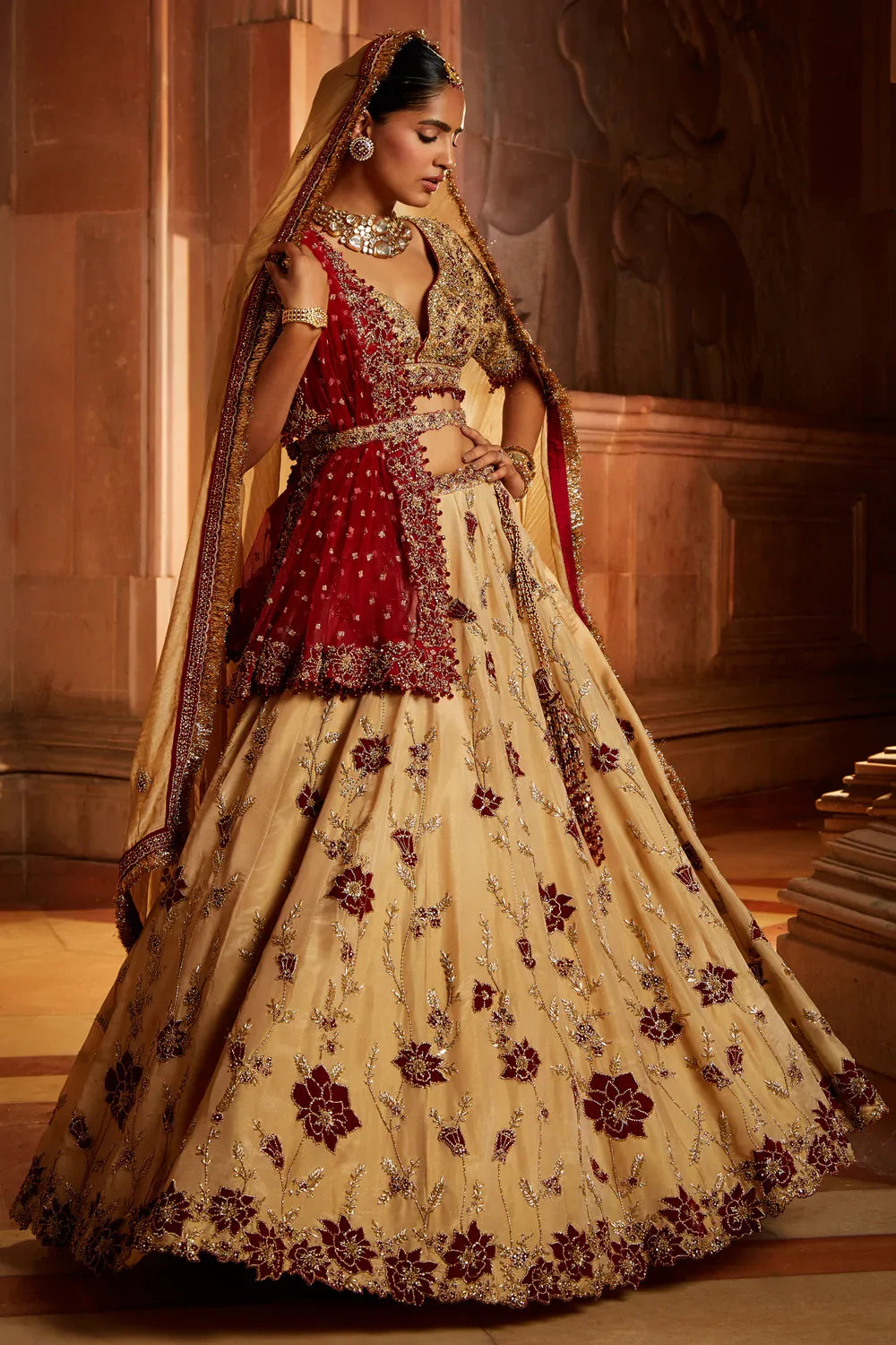 GOLD TISSUE LEHENGA CHOLI AND BELT WITH CONTRASTING RED TULLE DUPATTA