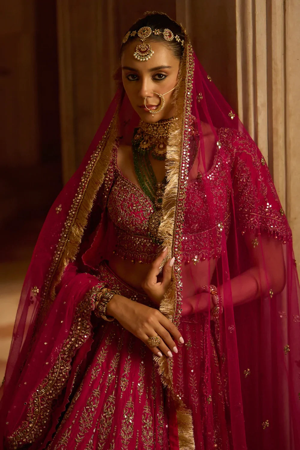 FUCHSIA RED RAW SILK BRIDAL LEHENGA CHOLI WITH A TULLE DUPATTA