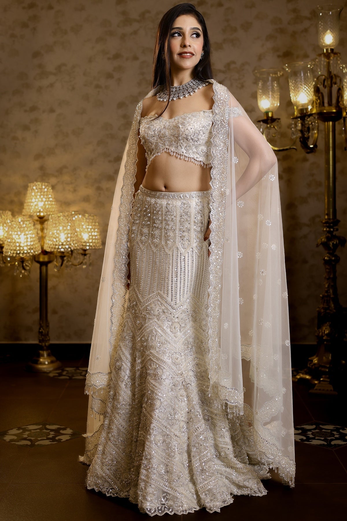 Ivory Net Hand Embroidered Fish-Cut Lehenga Set