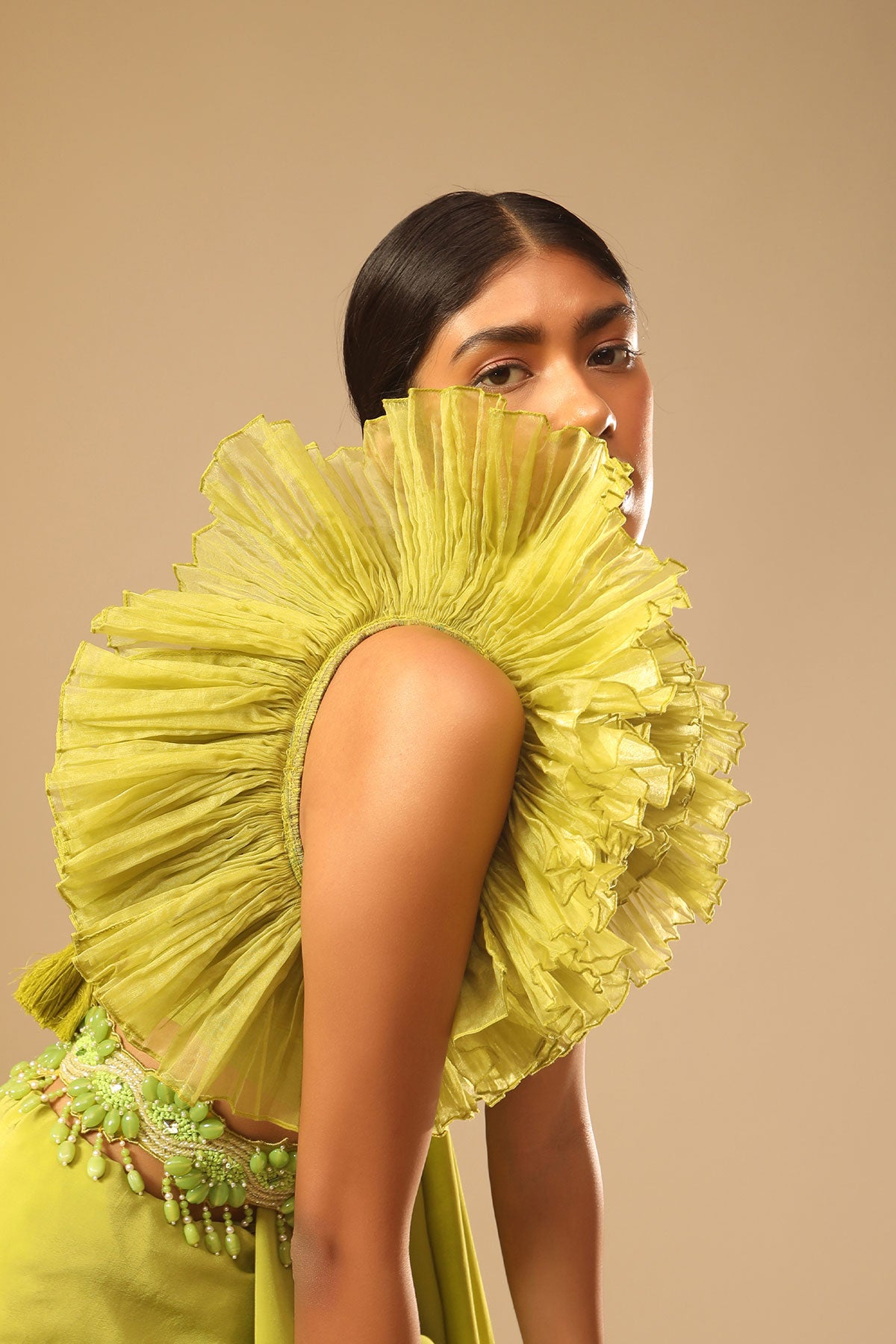 Lime Green Saree In Crepe With Elaborate Ruffle Sleeved Crop Top And Heavy Stone Embroidered Belt