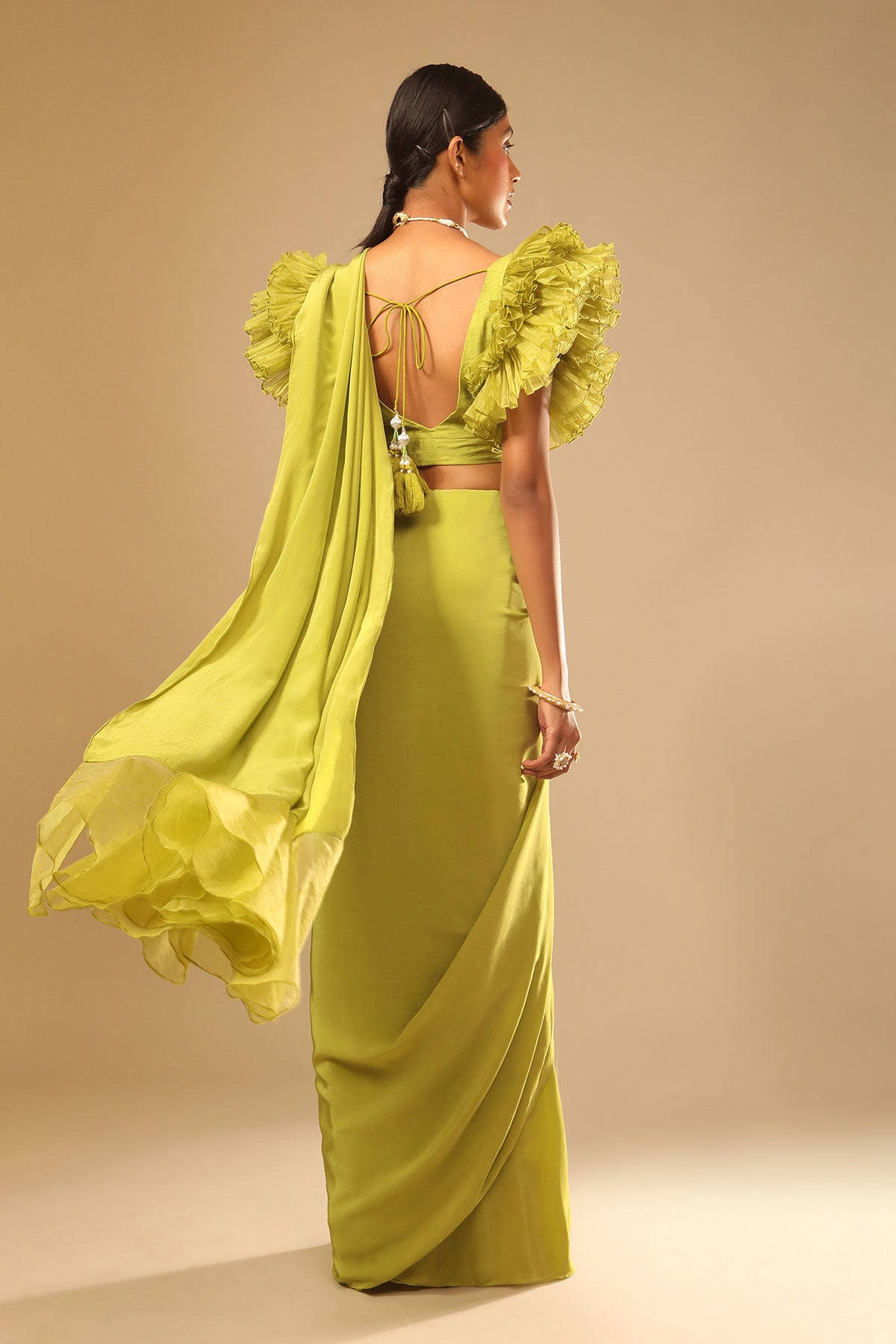 Lime Green Saree In Crepe With Elaborate Ruffle Sleeved Crop Top And Heavy Stone Embroidered Belt