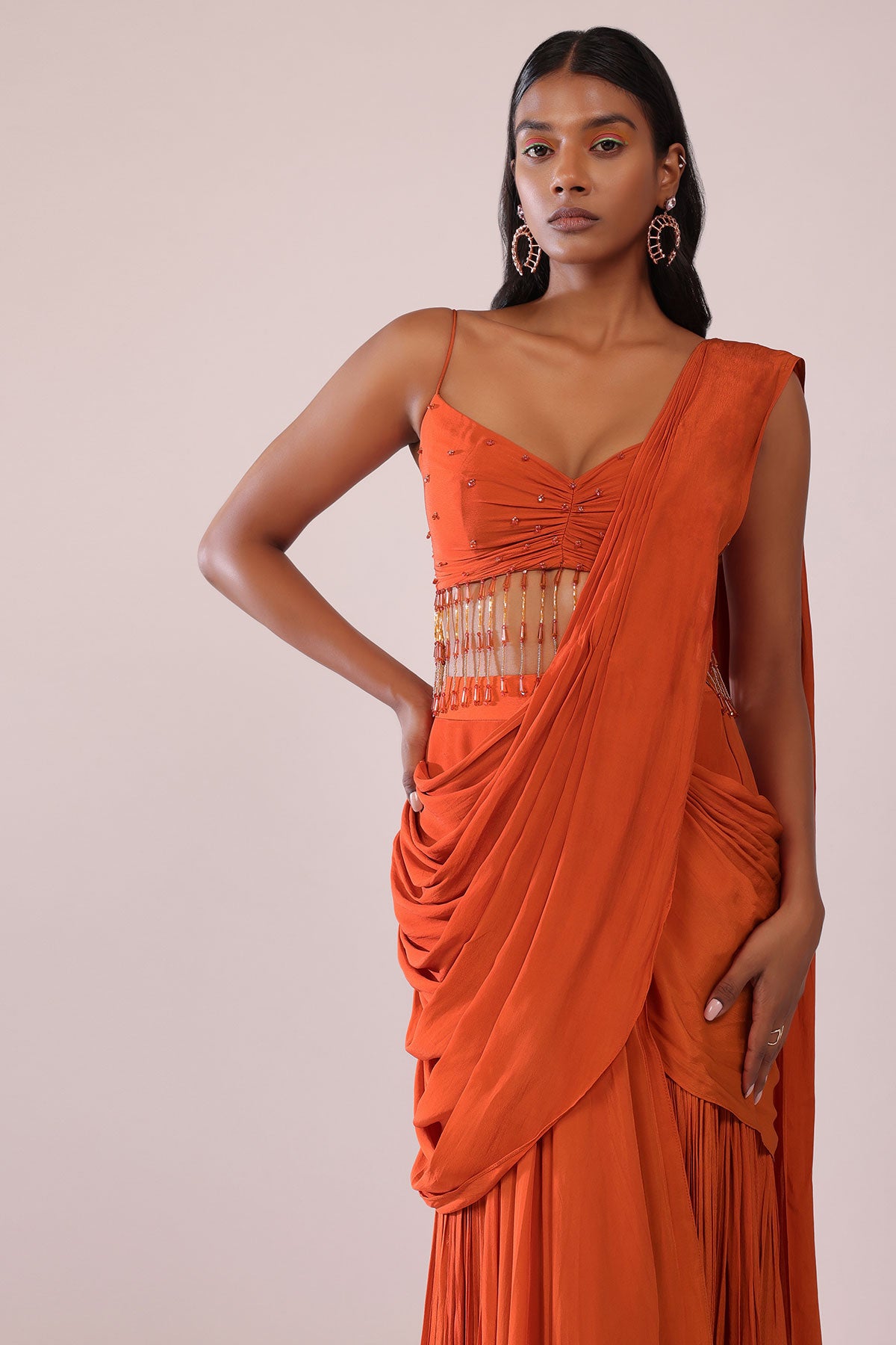 Orange Crepe Drape Saree And Blouse With Crystal Tassels All Over