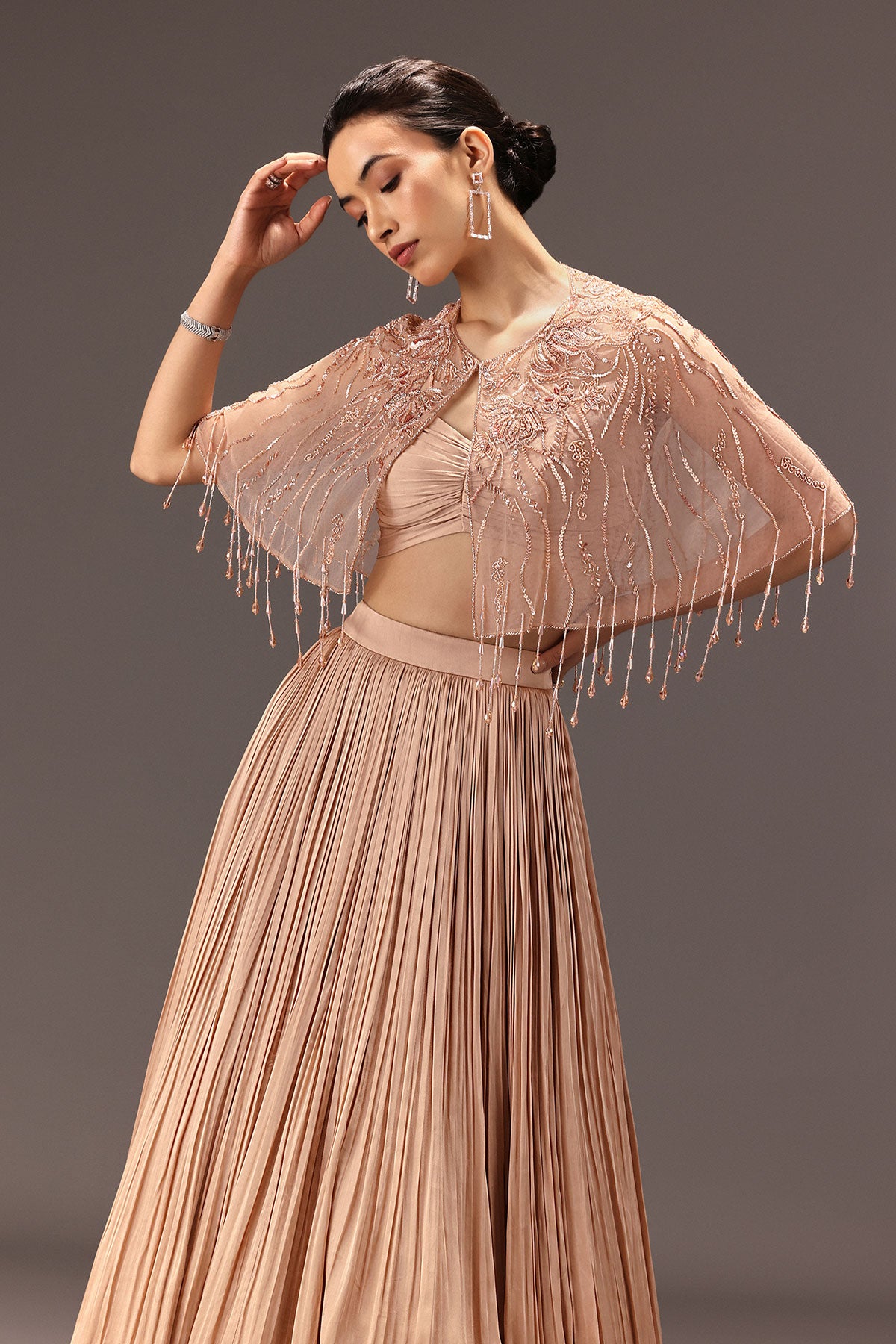 Nude Ruched Blouse With Cape And Layered Skirt