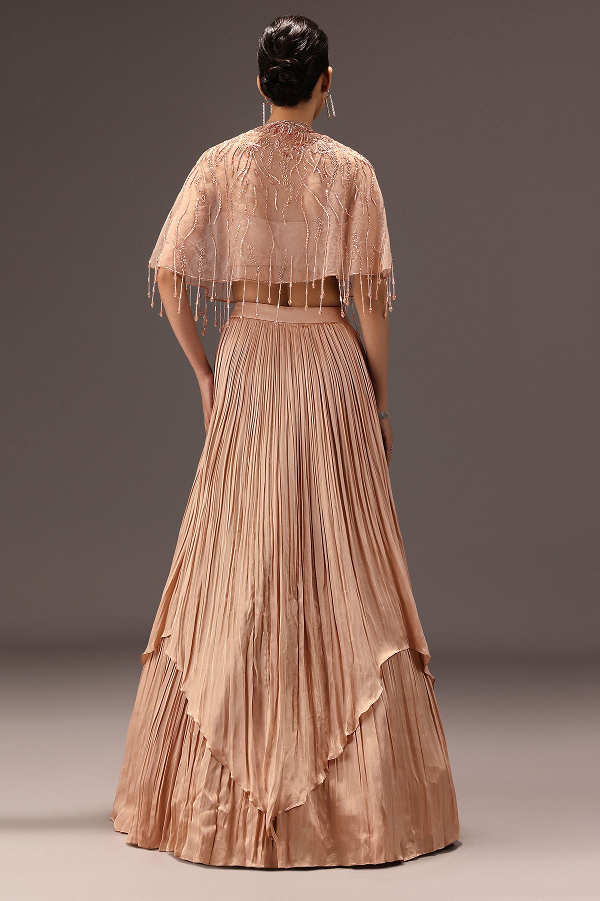 Nude Ruched Blouse With Cape And Layered Skirt
