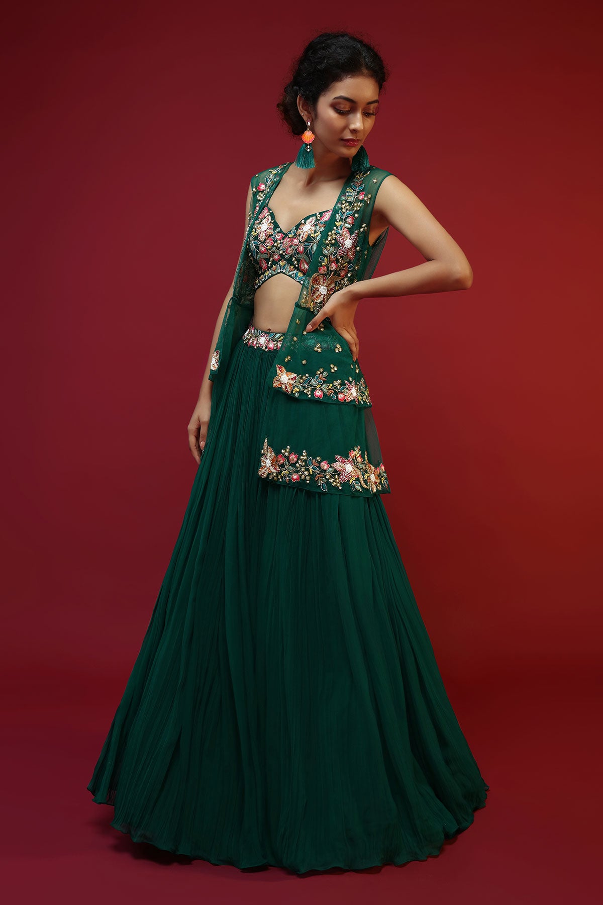 Bottle Green Lehenga Choli And Sleeveless Peplum Jacket Adorned With Colorful Resham And Moti Embroidered Flowers