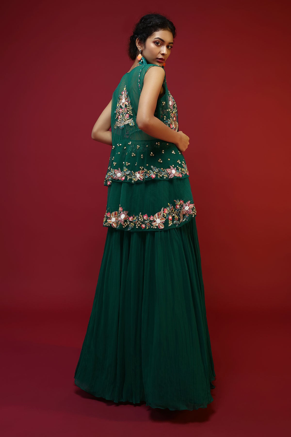 Bottle Green Lehenga Choli And Sleeveless Peplum Jacket Adorned With Colorful Resham And Moti Embroidered Flowers