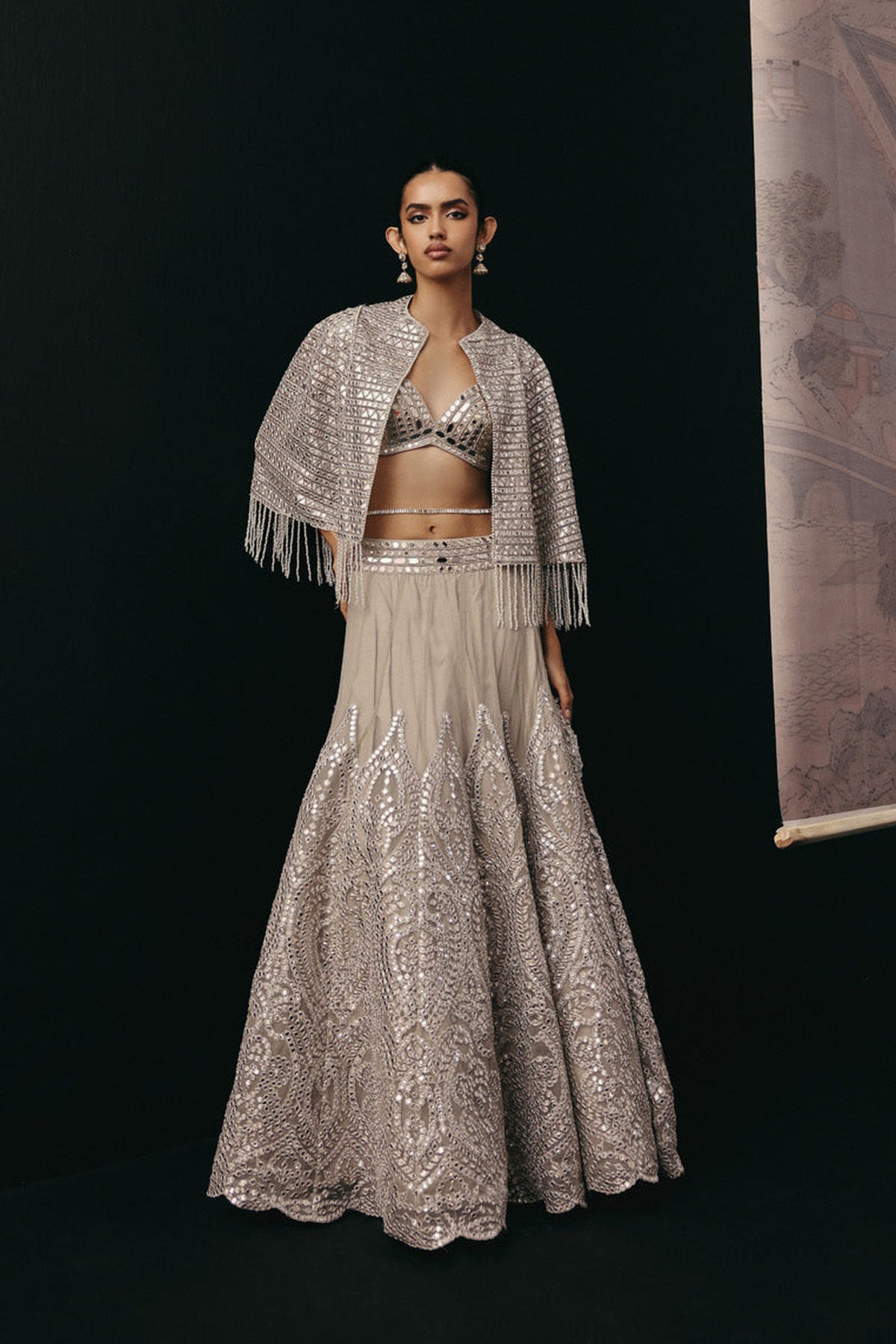 Silver Zari Mirrorwork Lehenga with Cape Sleeves Jacket and Bralette